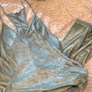 Out from under velvet jumper.